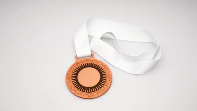 Fotografía real de Medallas Lux, acabado bronce · Vista 5